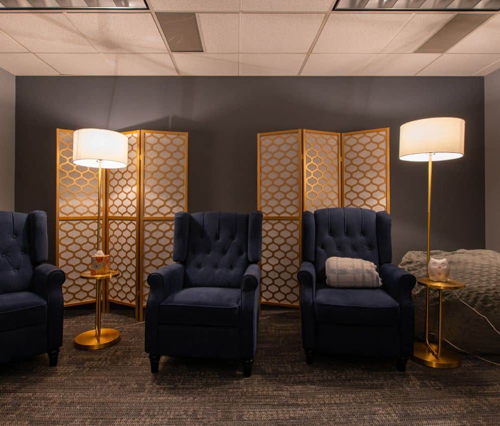 Blue chairs in a well lit room