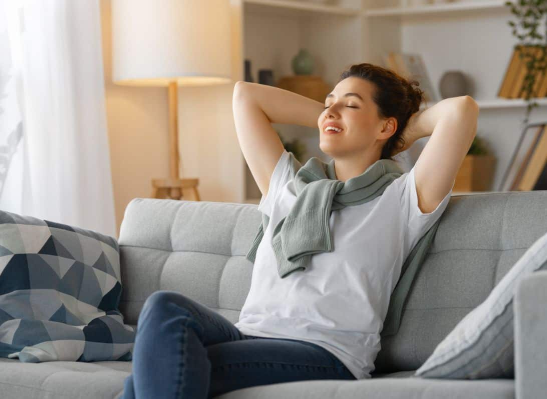Woman sitting on couch